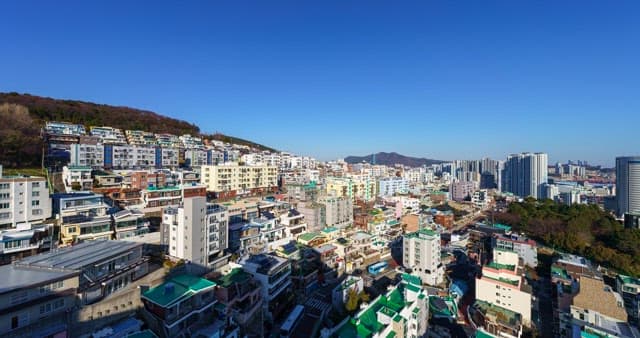 City filled with buildings from day to night