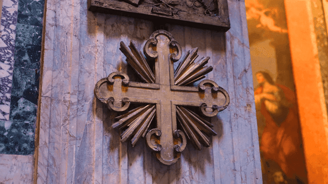 Decorative cross on a marble wall