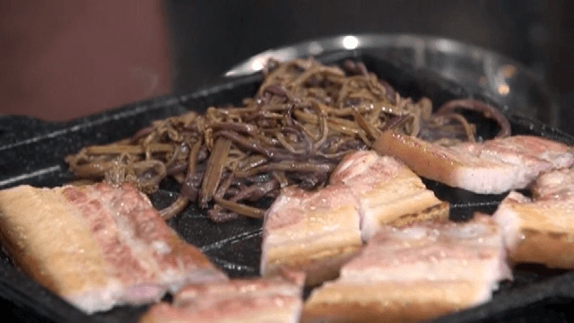 Grilled pork belly and bracken on a pan