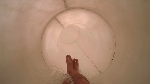 Point-of-view sliding down a water slide