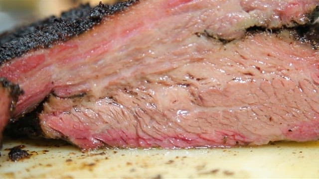 Juicy slices of smoked brisket on a plate