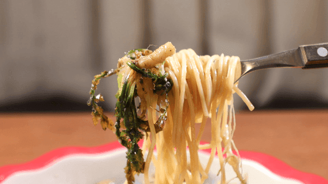 Fork lifting shepherd's purse vongole pasta