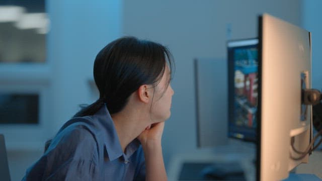 Woman working late at a computer