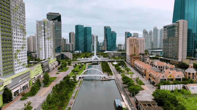 Modern cityscape with skyscrapers and canal