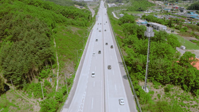 A highway surrounded by lush greenery