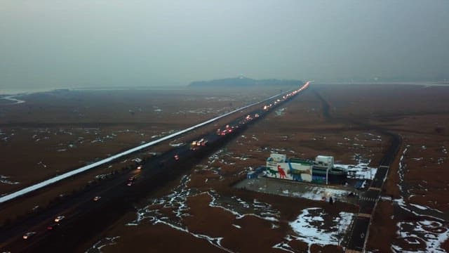 Long road through a snowy landscape