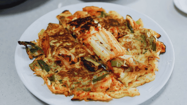 Kimchi pancake on a white plate
