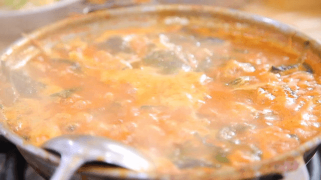 Pork backbone stew boiling in a pot