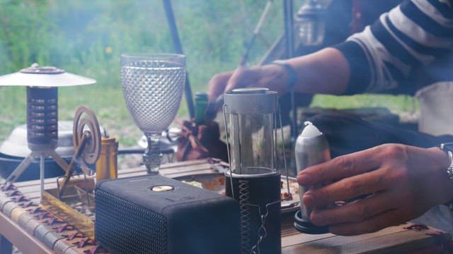 Lighting candles on a camping table