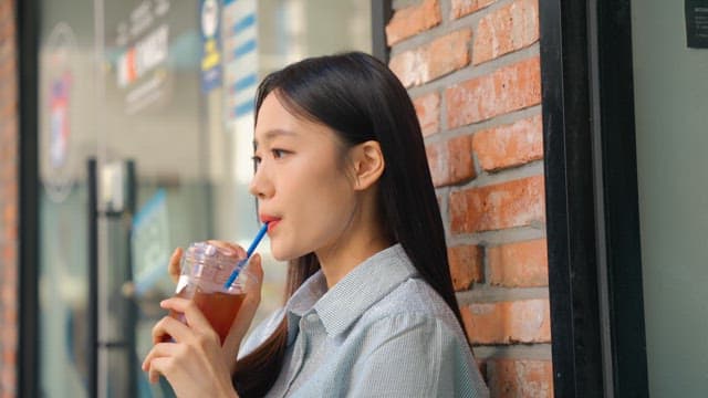 Young woman relaxing and drinking coffee