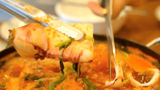 Cutting squid in Spicy Seafood Stew