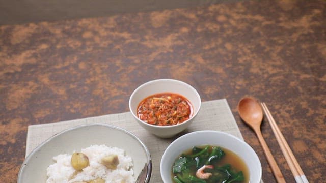 Traditional Korean meal with chestnut rice and spinach soup