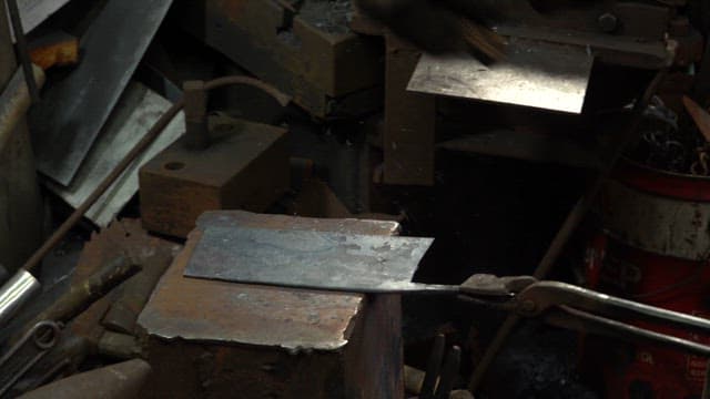 Metal being forged in a factory