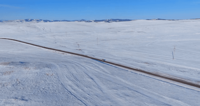 Snowy landscape with a lone road