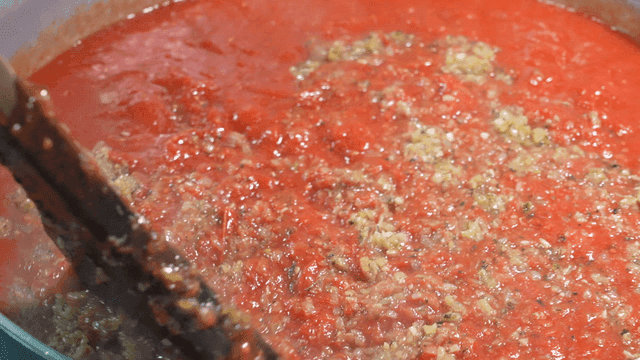 Tomato sauce simmering in a pot
