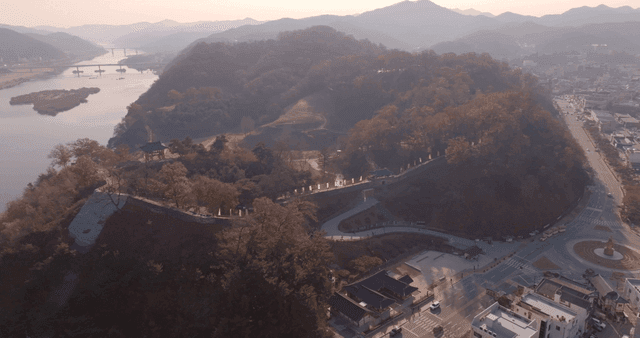 A scenic view of a historic site and cityscape