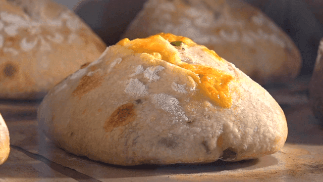 Campagne bread rising in oven during baking