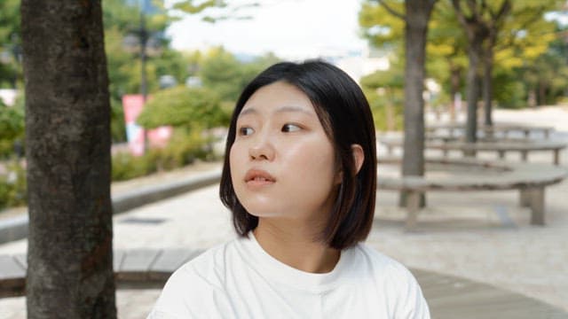 Young woman smiling in a park