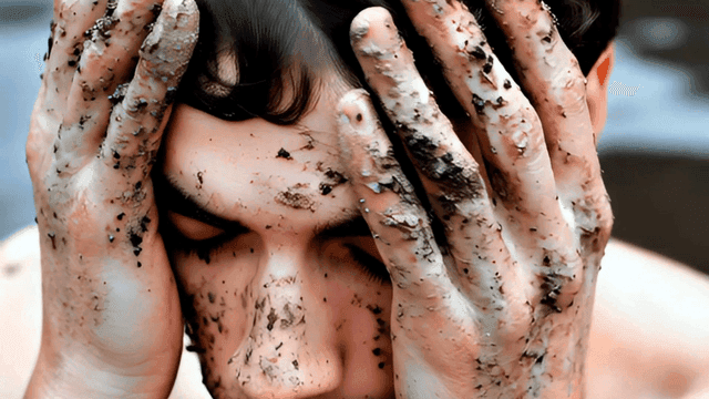 Man with dirt on his face