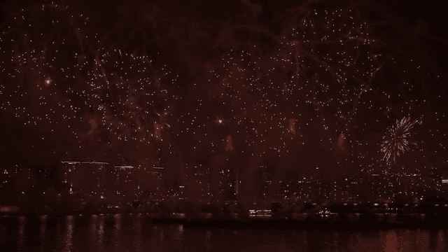Fireworks display over a city skyline