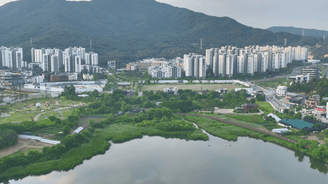 Cityscape with mountains and greenery