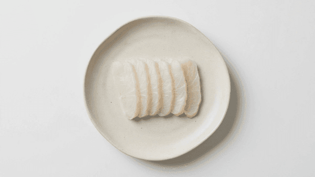 White sashimi neatly arranged on plate