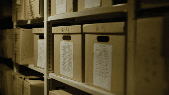 Dark case file room with boxes