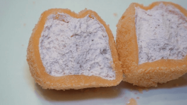 Close-up of a sliced rice cake with creamy filling