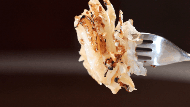 Roasted cabbage pierced with fork