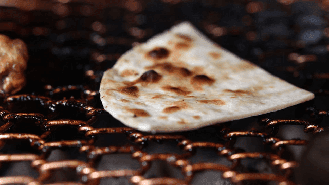 Tortillas placed on grill