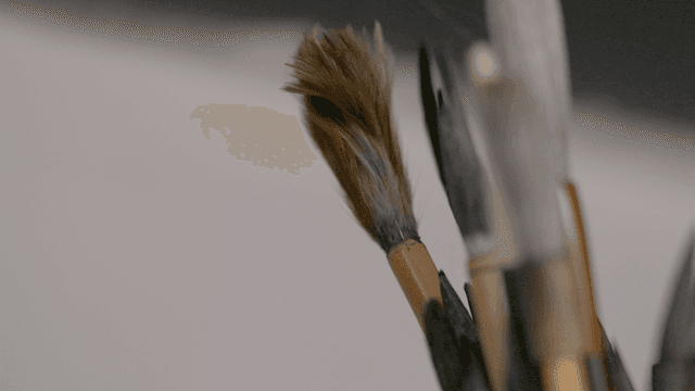 Various paintbrushes in a container