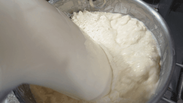 Makgeolli mixed with flour in large bowl