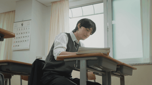 Student feeling tired in a classroom