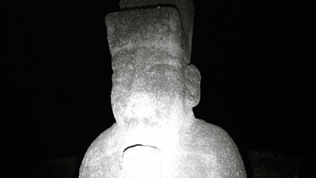 Traditional stone statue at night