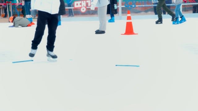 People ice skating at a rink