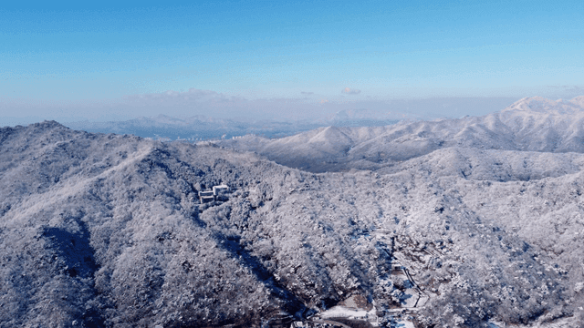 Snow-covered mountains under a clear sky