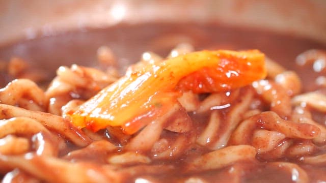 Kimchi stew with red bean noodles and chopsticks