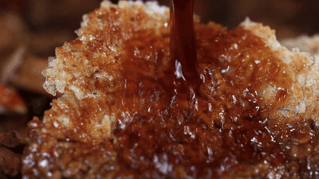 Soy sauce seasoning poured over crispy scorched rice