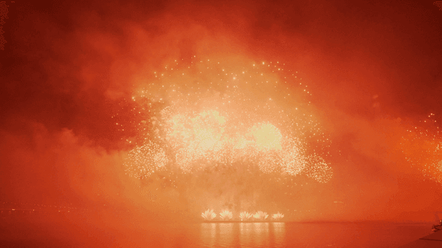 Fireworks shine brightly over river