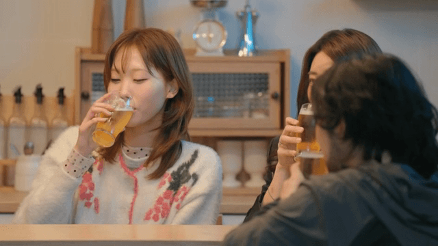 Friends toasting while enjoying beer together