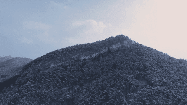 Snow-covered mountain under a clear sky