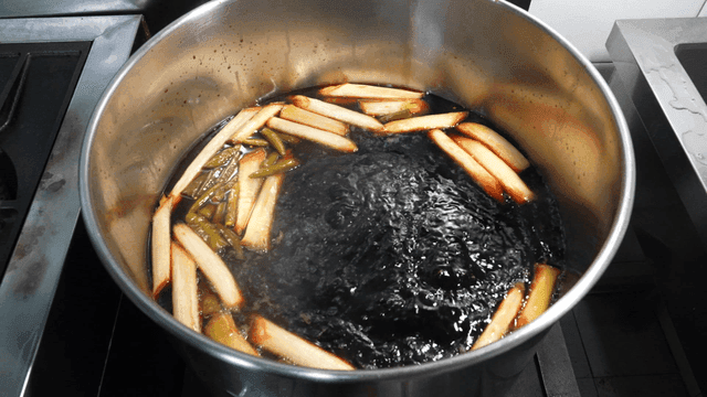 Soy sauce seasoning boiling in pot on stove