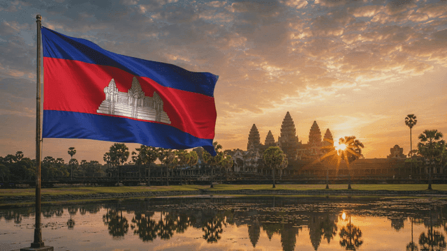 Cambodian flag waving at sunrise near Angkor Wat