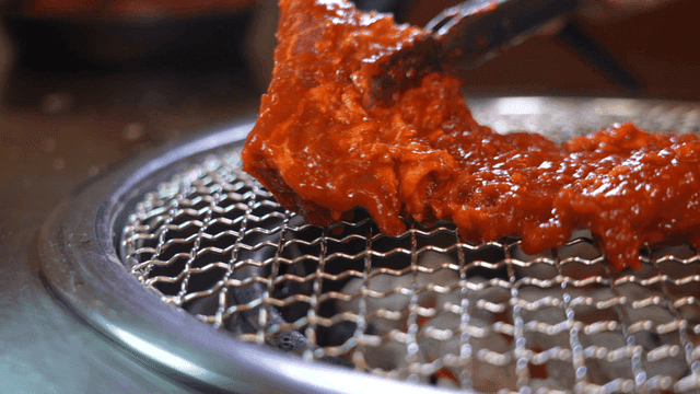 Meat marinated in gochujang on grill