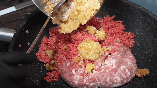 Minced garlic added to minced meat