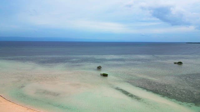 Tranquil sea with distant islands