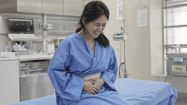 Female patient suffering in hospital gown