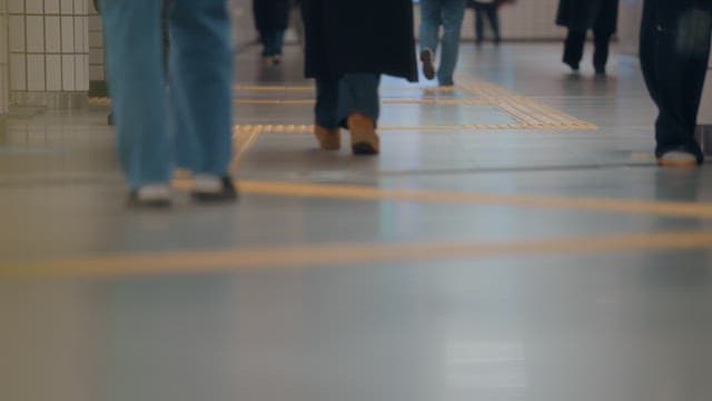 People walking in a busy subway station