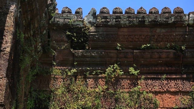 Ancient stone wall with intricate carvings