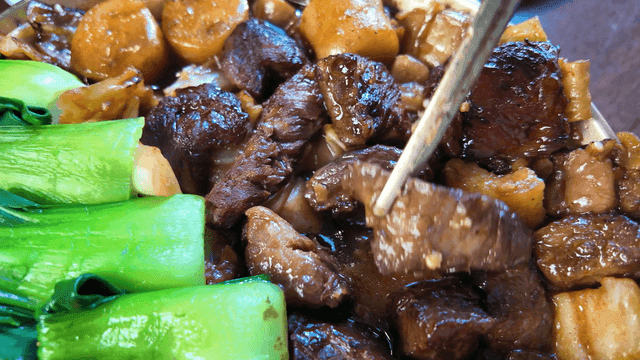 Delicious braised beef topped with bok choy